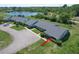 Scenic aerial view of home and community, showcasing the lush landscaping and proximity to lake at 12545 Dearborn Dr # D, Bayonet Point, FL 34667