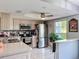 Bright kitchen with stainless steel appliances, ample cabinet space, and stylish countertops at 12545 Dearborn Dr # D, Bayonet Point, FL 34667