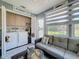 Laundry area with washer, dryer, cabinets, and view to outdoor area at 12545 Dearborn Dr # D, Bayonet Point, FL 34667