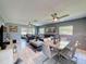 Spacious living space with dining area, comfortable seating, and lots of natural light at 12545 Dearborn Dr # D, Bayonet Point, FL 34667