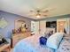 Bright and airy main bedroom with large windows and calm interior design at 12545 Dearborn Dr # D, Bayonet Point, FL 34667