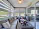 Relaxing sunroom with comfortable seating, large windows, and serene outdoor views at 12545 Dearborn Dr # D, Bayonet Point, FL 34667