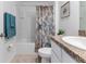 Bathroom featuring a shower and tub combination with a seashell themed shower curtain at 13160 Golden Lime Ave, Spring Hill, FL 34609