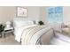A calming primary bedroom with plush carpeting, soft white walls, and window shutters for lots of natural light at 13160 Golden Lime Ave, Spring Hill, FL 34609