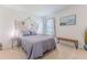 Cozy bedroom with a comfortable bed, stylish decor, and plenty of natural light at 13160 Golden Lime Ave, Spring Hill, FL 34609