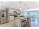 Kitchen featuring a stainless steel refrigerator and granite countertops at 13160 Golden Lime Ave, Spring Hill, FL 34609