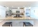 Modern kitchen island featuring granite countertops, stainless steel appliances and pendant lights at 13160 Golden Lime Ave, Spring Hill, FL 34609