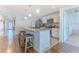 Open kitchen featuring a breakfast bar, stainless appliances, and views into other living spaces at 13160 Golden Lime Ave, Spring Hill, FL 34609