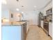 Bright kitchen with stainless steel appliances, granite countertops, and ample cabinet space at 13160 Golden Lime Ave, Spring Hill, FL 34609