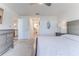 Cozy bedroom featuring a comfortable bed, ceiling fan, and neutral decor at 13160 Golden Lime Ave, Spring Hill, FL 34609
