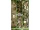 Real estate aerial view featuring the property, surrounding trees, and other homes at 13377 Montour St, Brooksville, FL 34613