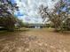 Expansive backyard with mature trees, ideal for outdoor activities and relaxation at 13377 Montour St, Brooksville, FL 34613