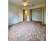 Comfortable bedroom with open closet space and a door leading to the bath and vanity area at 13377 Montour St, Brooksville, FL 34613