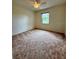 Bedroom featuring ceiling fan and window providing plenty of natural light at 13377 Montour St, Brooksville, FL 34613