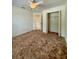 Comfortable bedroom with a ceiling fan and a closet, creating a cozy and functional space at 13377 Montour St, Brooksville, FL 34613