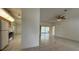 Open-concept living room showing tile flooring and partial views of the kitchen at 13377 Montour St, Brooksville, FL 34613