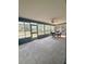 Bright sunroom with many windows and an outdoor view, perfect for entertaining and relaxation at 13377 Montour St, Brooksville, FL 34613