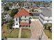 Gorgeous three-story waterfront home with brick driveway, manicured lawn, and convenient access to the water at 13741 Judy Ave, Hudson, FL 34667