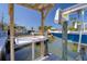Close-up view of a boat lift with sink, showcasing the convenience and features of the waterfront property at 13741 Judy Ave, Hudson, FL 34667
