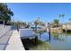 Well-equipped boat lift ensuring easy storage and maintenance, set in a peaceful waterfront community at 13741 Judy Ave, Hudson, FL 34667