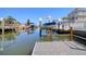 Enjoy waterfront living with a private boat dock and lift, providing easy access to the open water and beautiful views at 13741 Judy Ave, Hudson, FL 34667
