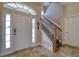 Foyer with tile flooring, a staircase, and natural light at 13741 Judy Ave, Hudson, FL 34667