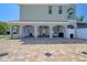 Spacious three-car garage with brick flooring and ample storage space at 13741 Judy Ave, Hudson, FL 34667