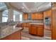 Spacious kitchen with granite countertops, stainless steel appliances and a breakfast bar at 13741 Judy Ave, Hudson, FL 34667
