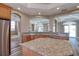 Kitchen featuring granite countertops and island with stainless steel appliances at 13741 Judy Ave, Hudson, FL 34667