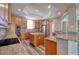 Spacious kitchen featuring granite countertops, stainless steel appliances, and a central island at 13741 Judy Ave, Hudson, FL 34667