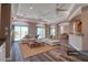Bright living room featuring hardwood floors, modern furniture, and sliding doors to the balcony at 13741 Judy Ave, Hudson, FL 34667