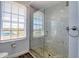 Modern shower with a glass door, a tiled walls, and natural pebble flooring at 13741 Judy Ave, Hudson, FL 34667