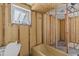 Under-construction bathroom featuring a bathtub and tiled floors at 13815 Plumosa Ave, Hudson, FL 34667