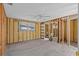 Large bedroom ready for remodel features updated tile floors and ample natural light at 13815 Plumosa Ave, Hudson, FL 34667