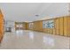 Spacious room under renovation, with tile floors, and ample natural light throughout at 13815 Plumosa Ave, Hudson, FL 34667