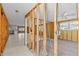 Renovated space with exposed framework, open layout, tile flooring, and natural light at 13815 Plumosa Ave, Hudson, FL 34667