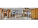 Bright kitchen features white cabinets, stone countertops, and tiled backsplash at 13815 Plumosa Ave, Hudson, FL 34667
