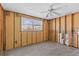 An unfinished living room with tile floors and a ceiling fan at 13815 Plumosa Ave, Hudson, FL 34667
