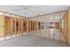 Large room with light flooring ready for customization and renovation at 13815 Plumosa Ave, Hudson, FL 34667