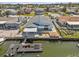 Waterfront home with covered patio, dock, and floating dock for easy boat access at 13815 Plumosa Ave, Hudson, FL 34667