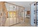 The room under construction with checkered tile floor, and ceiling fan at 13815 Plumosa Ave, Hudson, FL 34667