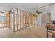 A room under construction featuring tile floors and a ceiling fan at 13815 Plumosa Ave, Hudson, FL 34667