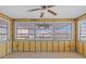 Bright sun room with tile flooring and multiple windows offering lots of natural light at 13815 Plumosa Ave, Hudson, FL 34667