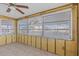 Bright sun room with tile flooring and multiple windows offering lots of natural light at 13815 Plumosa Ave, Hudson, FL 34667