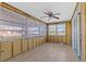 Bright sun room with tile flooring and multiple windows offering lots of natural light at 13815 Plumosa Ave, Hudson, FL 34667
