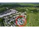 Aerial view showing the neighborhood's proximity to shopping centers and natural surroundings at 16022 Westerham Dr, Tampa, FL 33647
