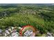 Aerial view showing the property's location amidst lush greenery and neighborhood homes at 16022 Westerham Dr, Tampa, FL 33647
