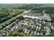 Scenic aerial view of a neighborhood near shopping and commerce areas with lush landscaping and tree coverage at 16022 Westerham Dr, Tampa, FL 33647