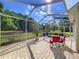 Outdoor patio with seating and green scenery at 16022 Westerham Dr, Tampa, FL 33647