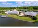 Community center featuring a pool, lakeside access, and well-maintained landscaping at 16022 Westerham Dr, Tampa, FL 33647